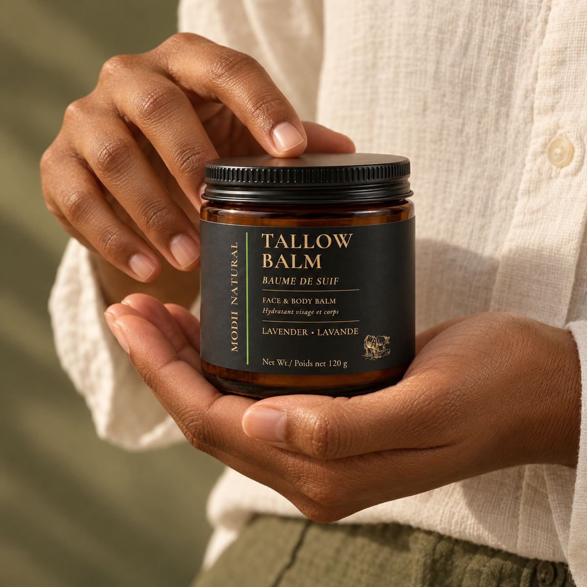 MODII Natural Lavender Tallow Balm — product shown in adult hands for scale