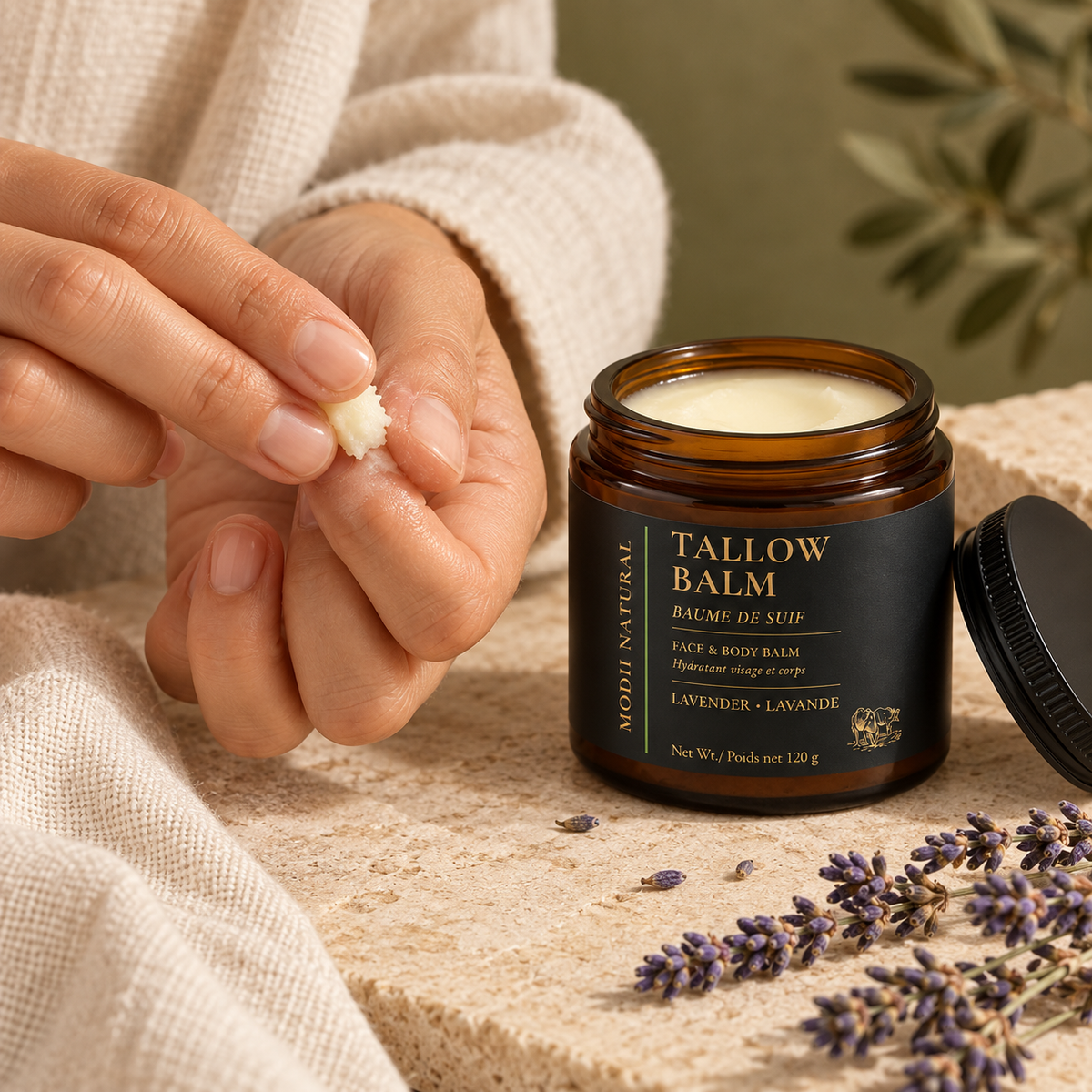 MODII Natural Lavender Tallow Balm — a small amount prepared on adult fingertips before application
