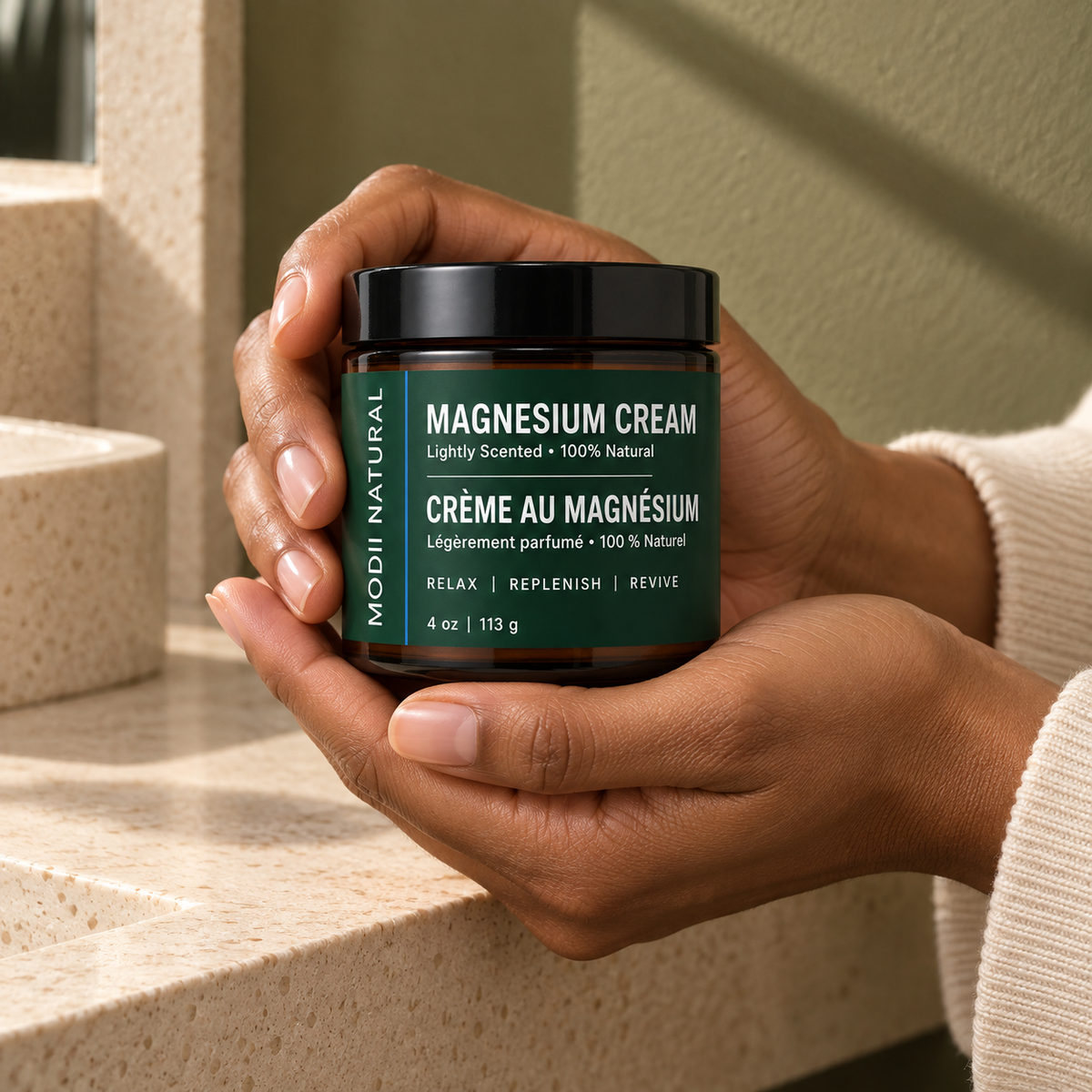 MODII Natural Magnesium Body Cream, Lemongrass - 113g — product shown in adult hands for scale
