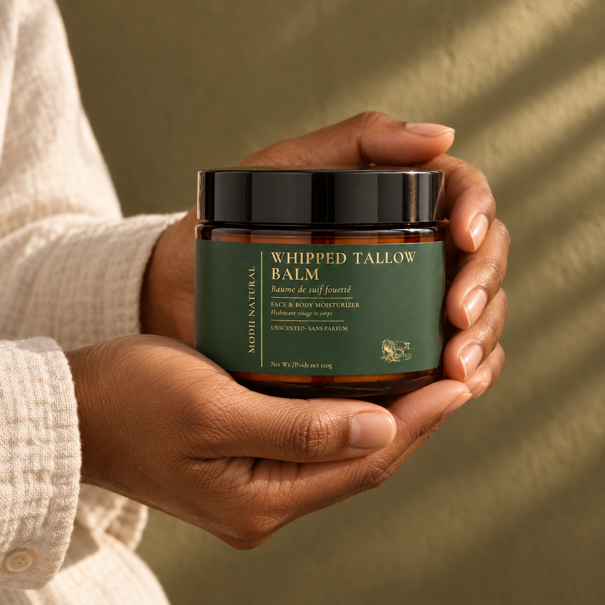 MODII Natural Whipped Tallow Balm - 120g — product shown in adult hands for scale
